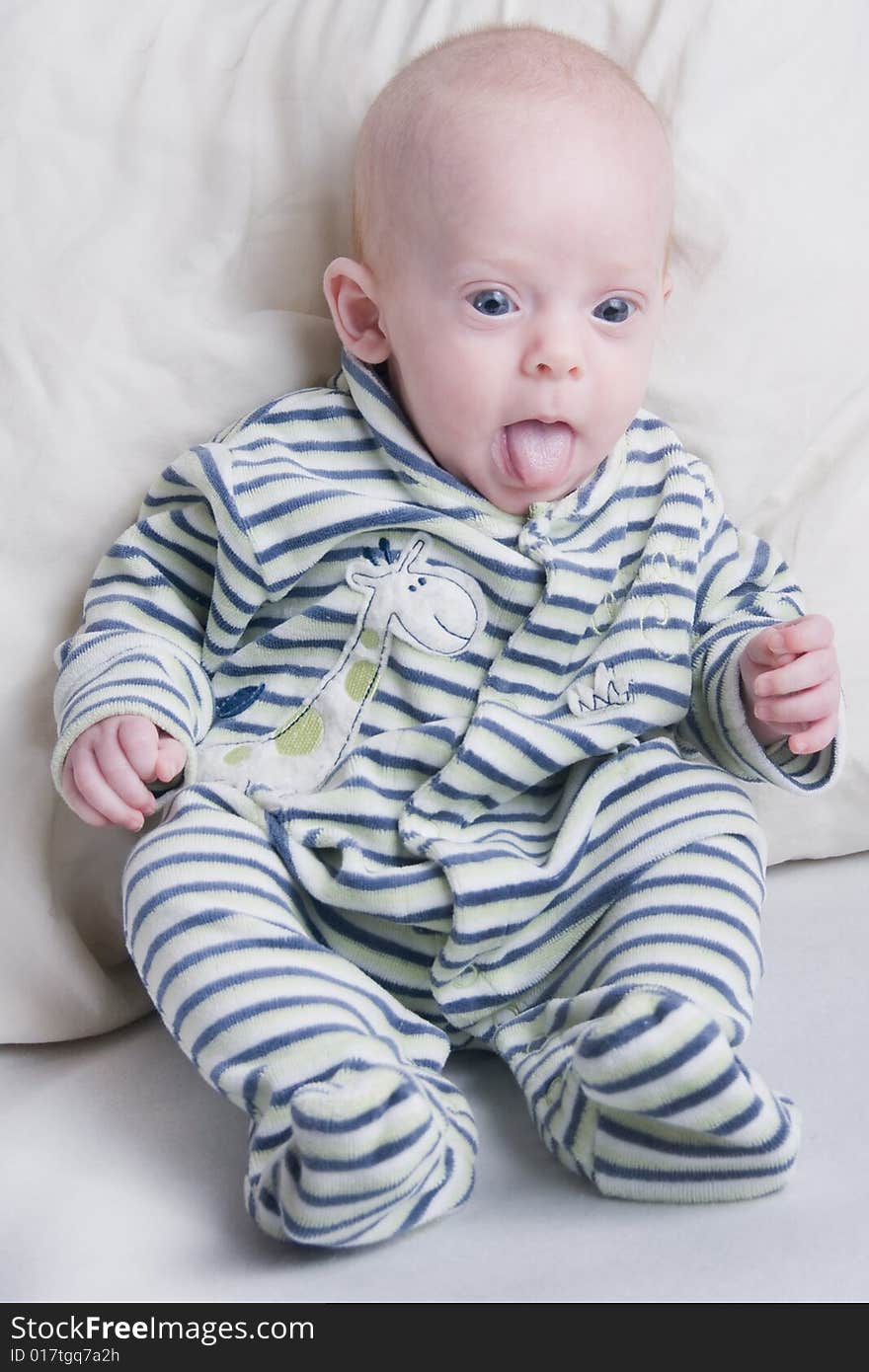 Newborn baby over light background