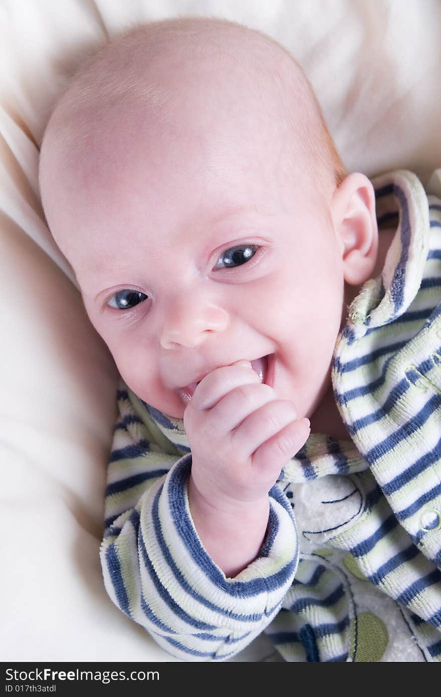 Newborn baby over light background