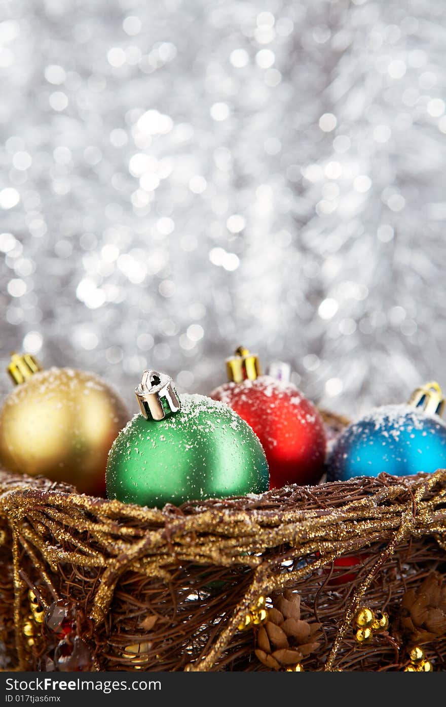 Multi-coloured balls on a silvery flickering background. Multi-coloured balls on a silvery flickering background