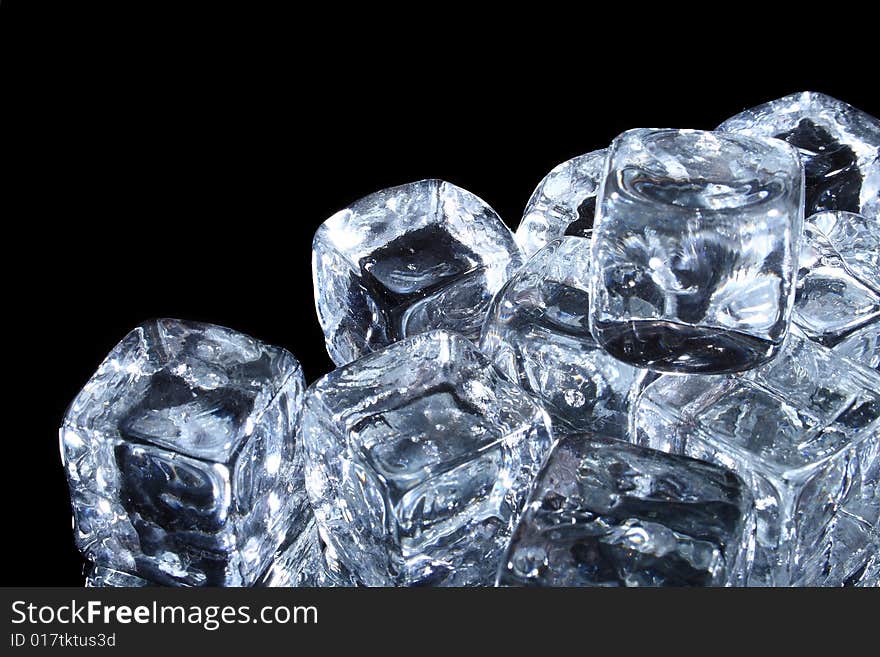 Ice cubes isolated on black background