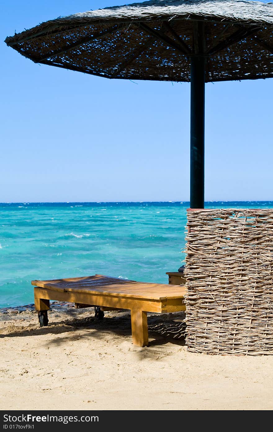 Beach bed and umbrella on the beach