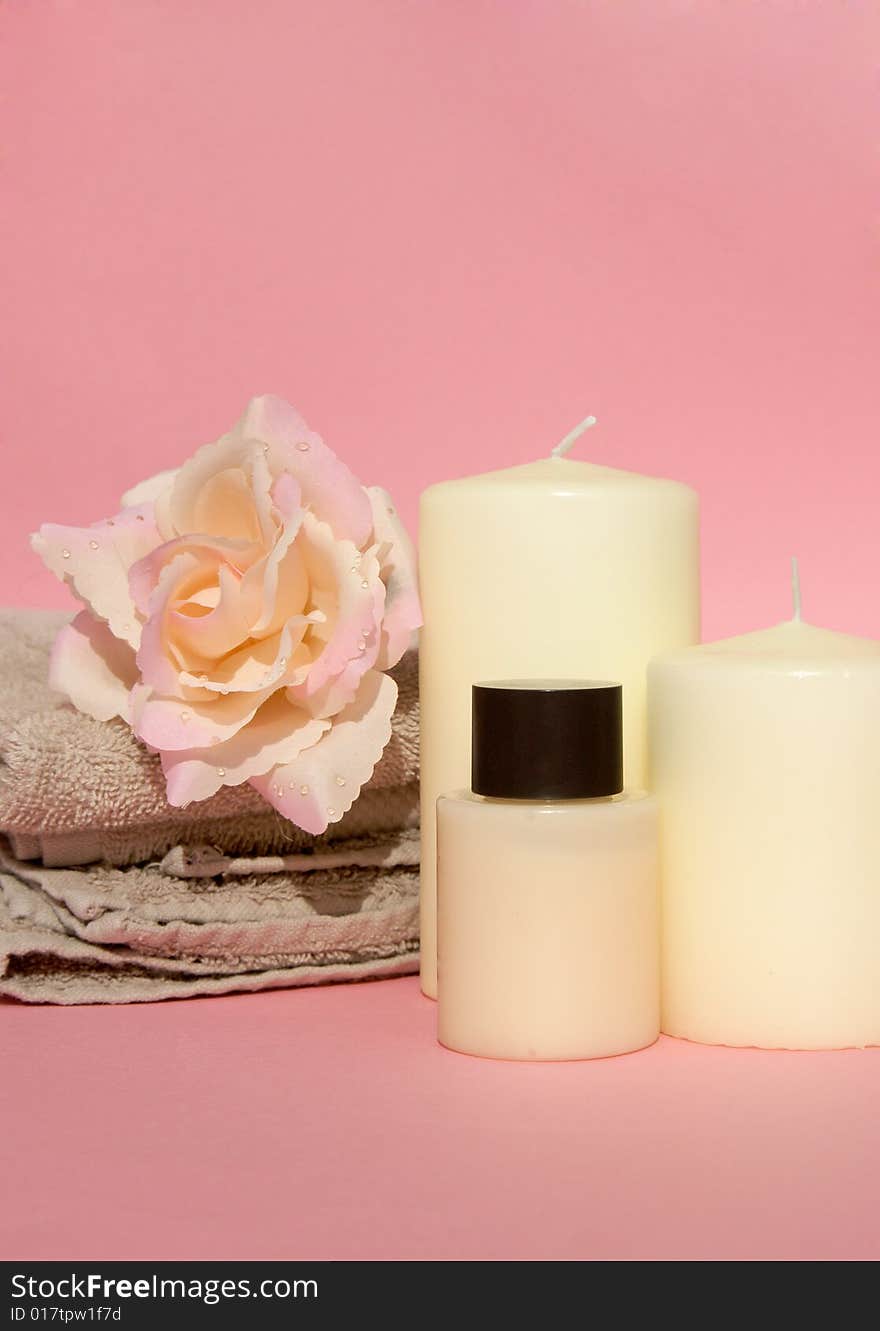 Refreshing spa luxury with candle, rose and beige spa towel. Refreshing spa luxury with candle, rose and beige spa towel