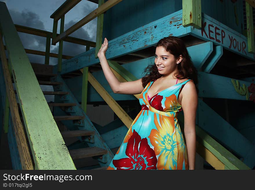 Young woman smiling and waving to friends