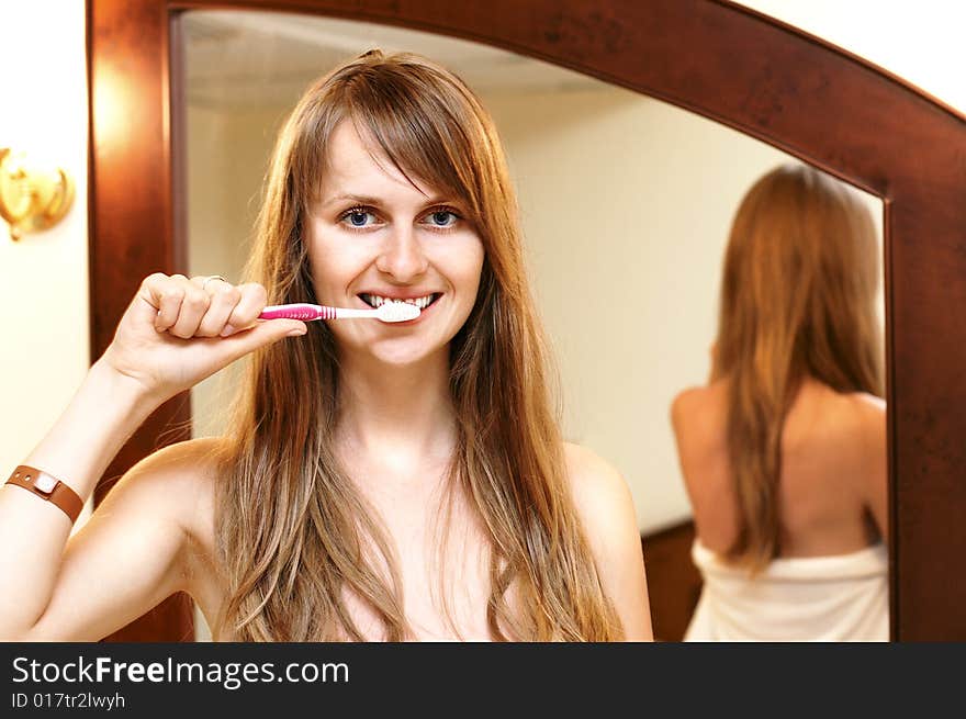 Pretty smiling girl with toothbrush