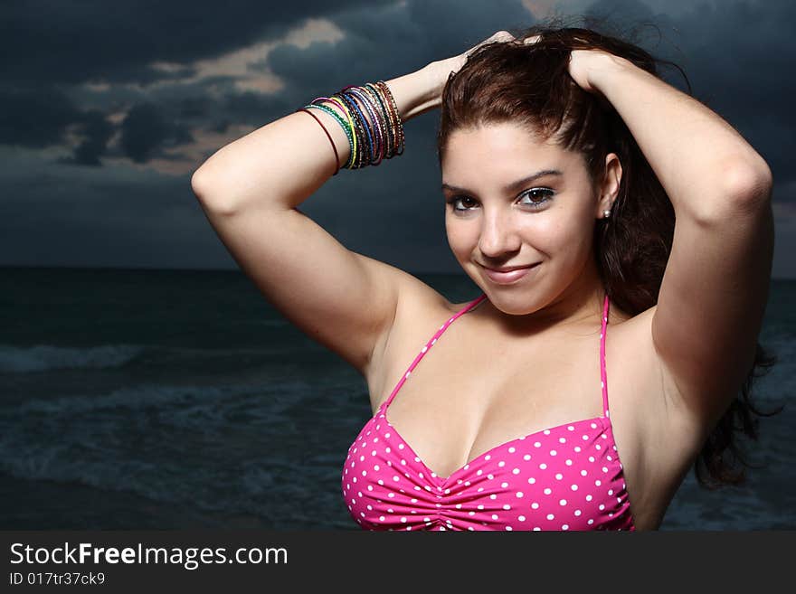 Young female posing in a pink bikini. Young female posing in a pink bikini