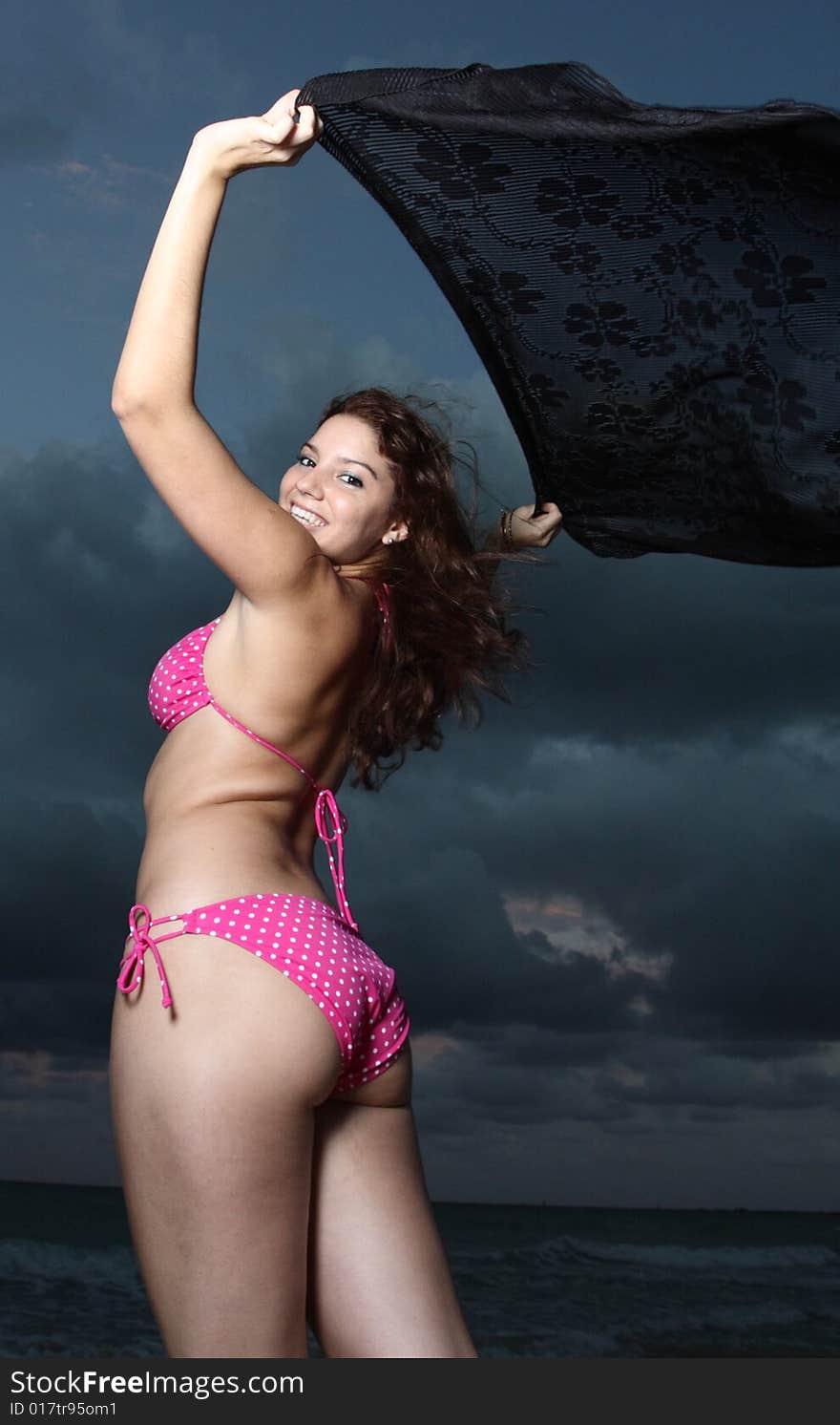 Young female posing in a pink bikini. Young female posing in a pink bikini