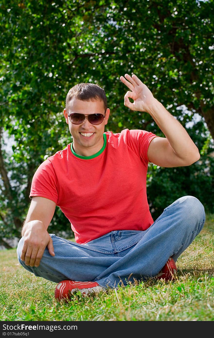 Young Man Giving OK Gesture