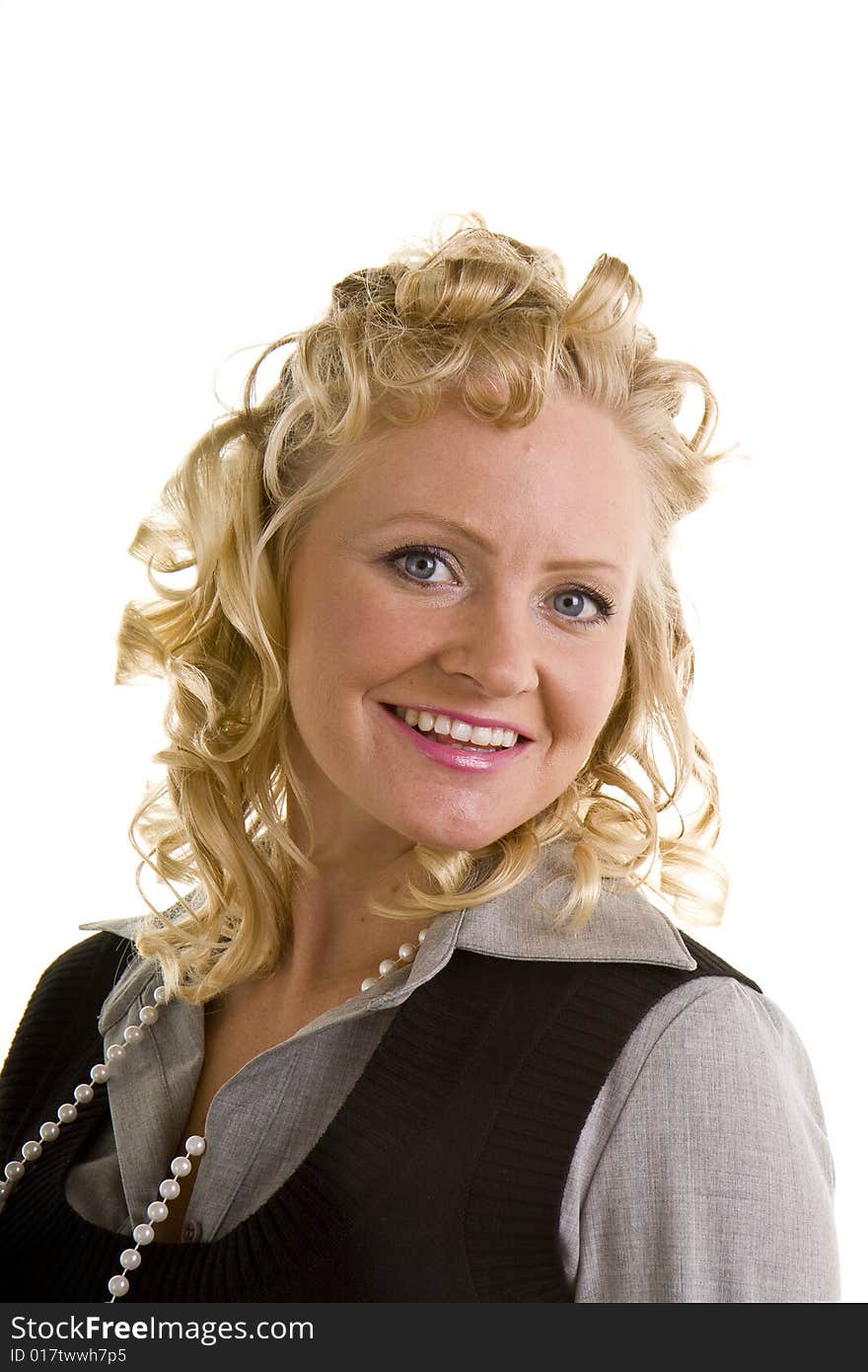 A curly blonde woman with a great smile and pearls. A curly blonde woman with a great smile and pearls