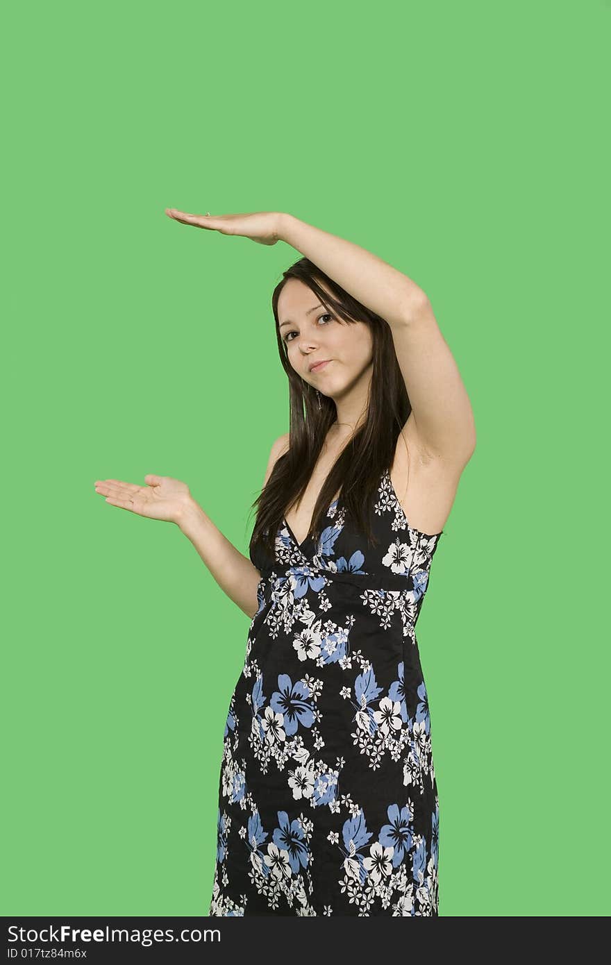 Woman taking a pose over green background