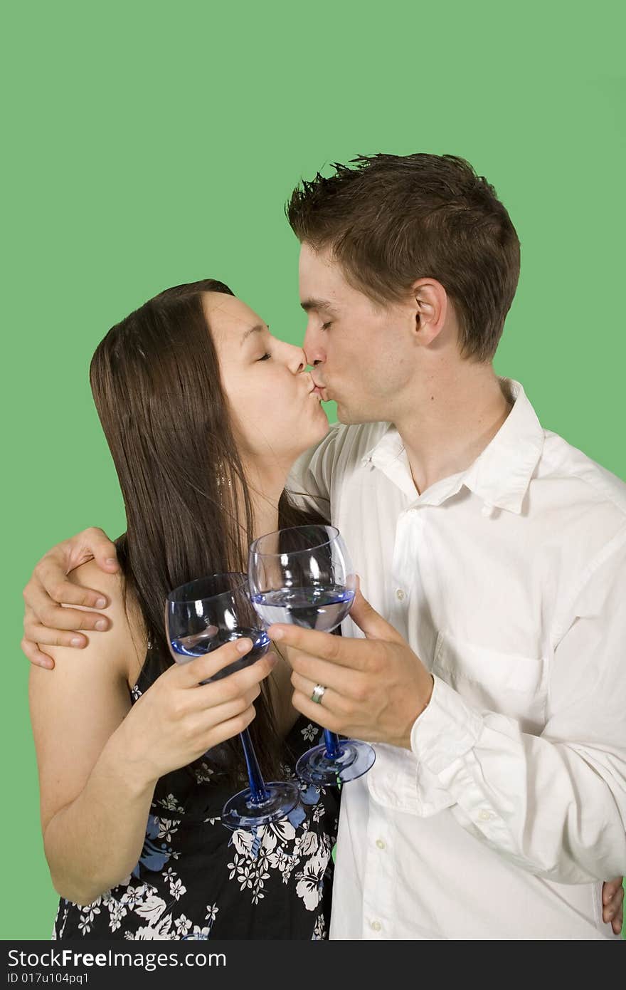 Couple drinking and smiling over green screen