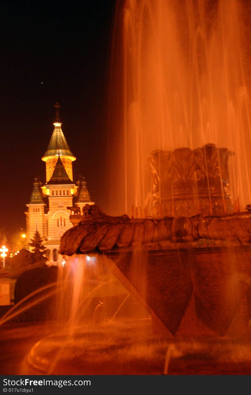 Artesian well with a church in the background