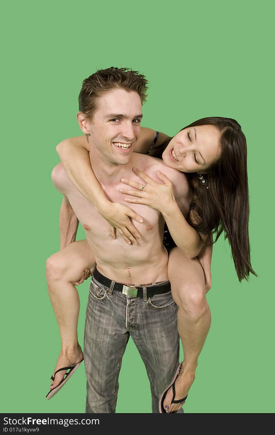 Happy couple having fun over green screen