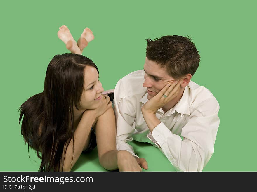 Couple talking on floor over green screen