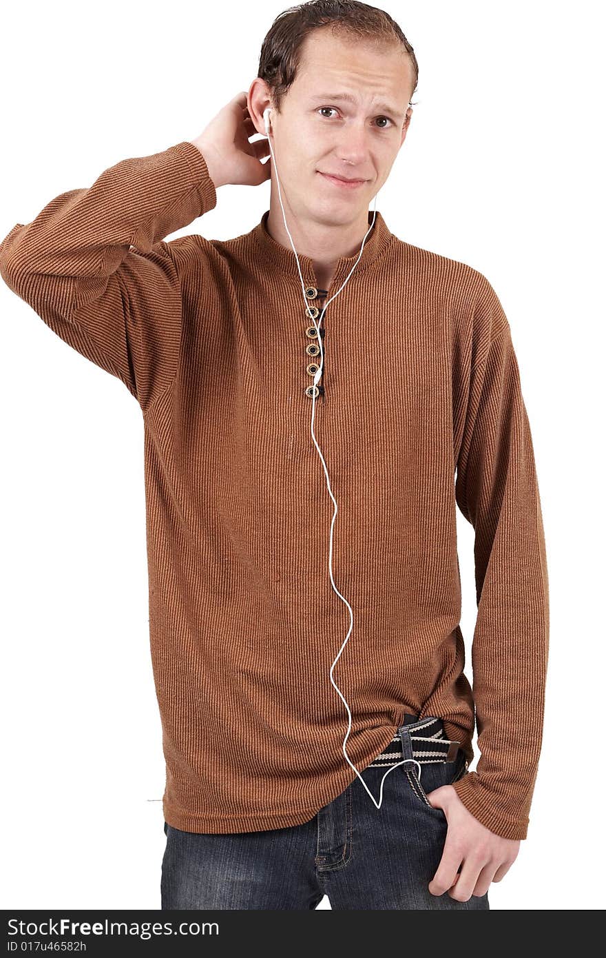 Young caucasian man wearing trendy clothes listening to music. Isolated on white background. Young caucasian man wearing trendy clothes listening to music. Isolated on white background