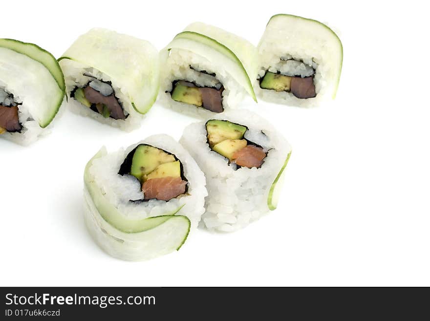 Sushi rolls with avocado, salmon, cucumber are isolated on white background