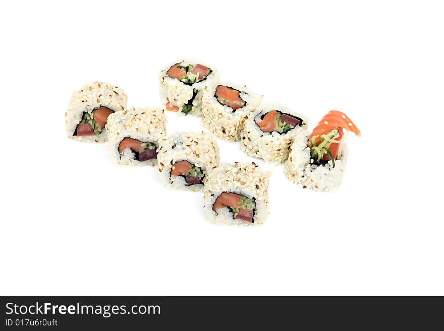 Sushi rolls with salmon, cucumber and tomato are isolated on the white background