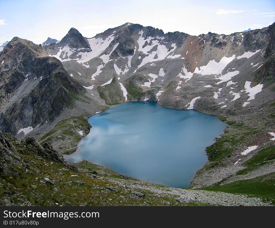 Blue Lake - one of two lakes in the Murundzhu valley, North Caucasus Mountains, Russia. Blue Lake - one of two lakes in the Murundzhu valley, North Caucasus Mountains, Russia