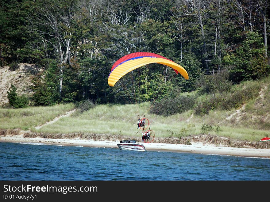 Para-gliders floating over the lake shore. Para-gliders floating over the lake shore.