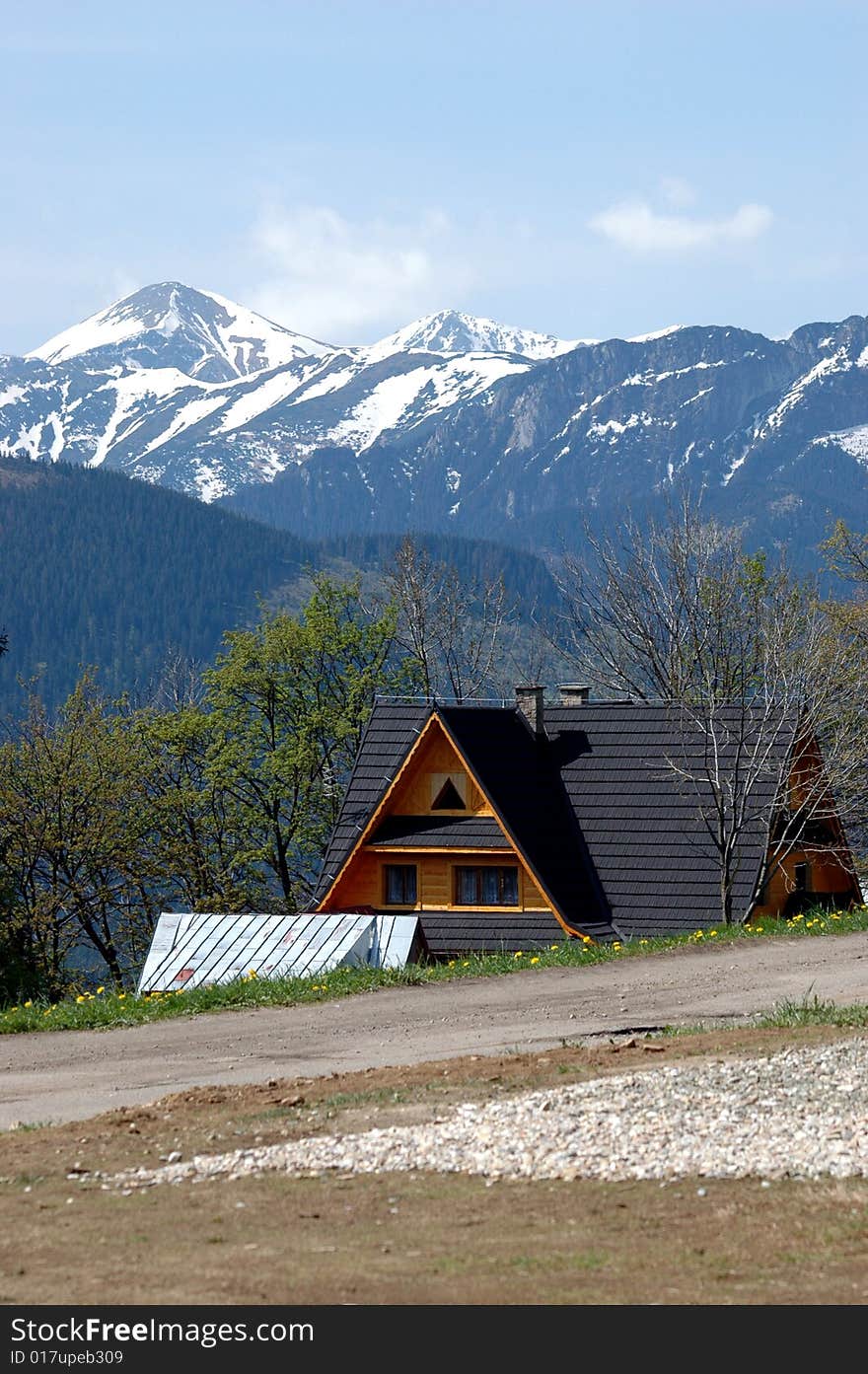 Highest mountain in Poland, Tatra with traditional, wooden house in Zakopane area. Highest mountain in Poland, Tatra with traditional, wooden house in Zakopane area.