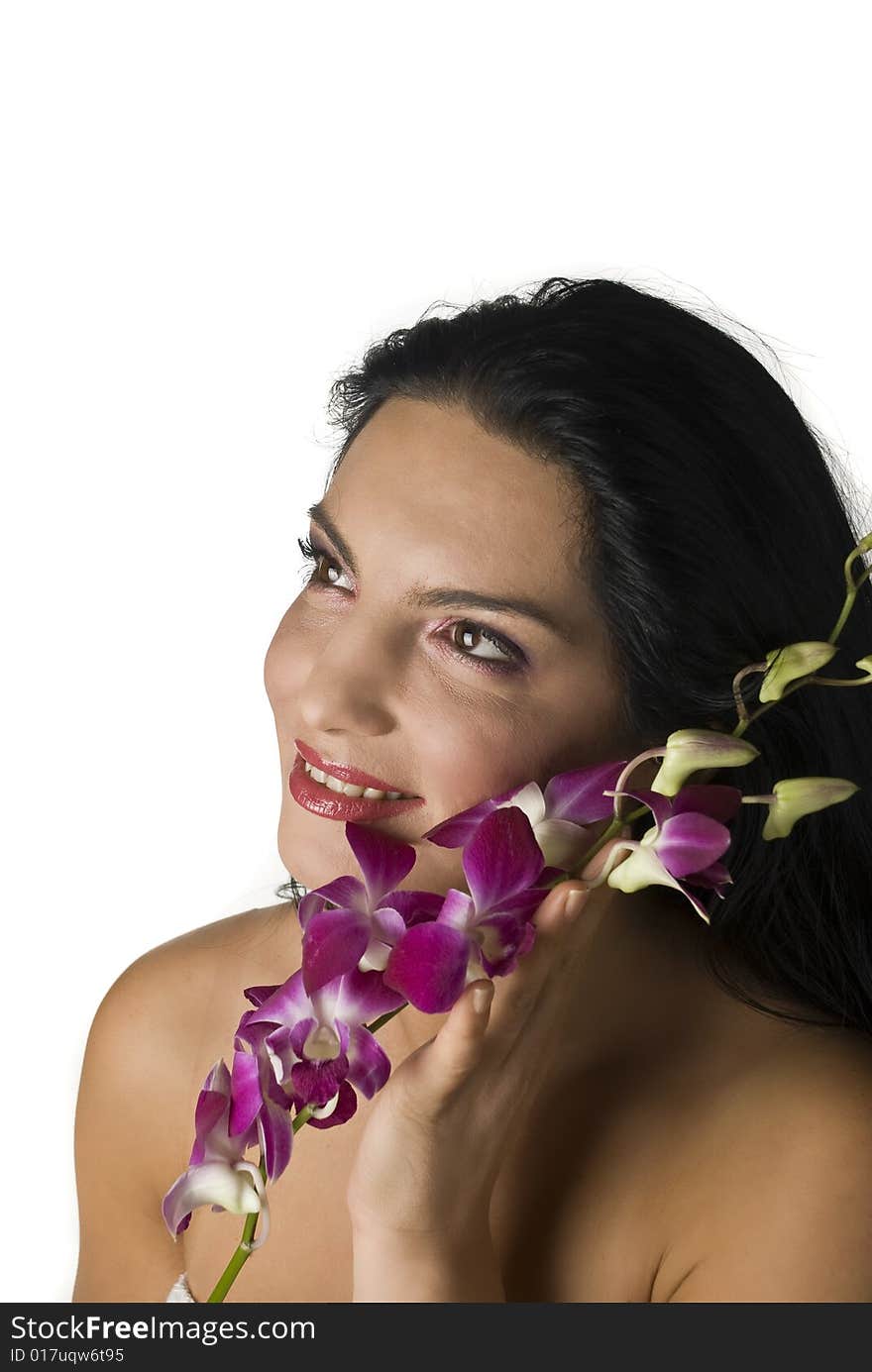 Woman with orchid looking away,more spa photos in Spa,aromatherapy ,massage