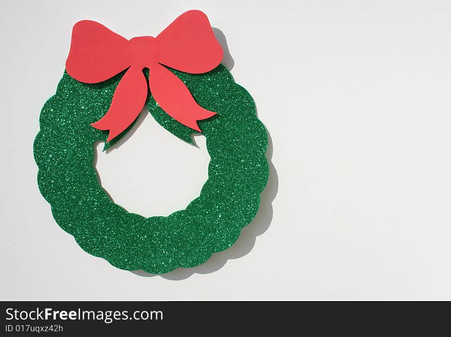 Green wreath with a red bow. Green wreath with a red bow.