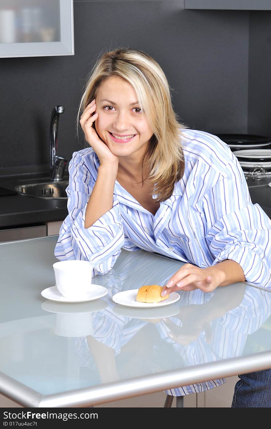 Happy woman eating at home. Happy woman eating at home