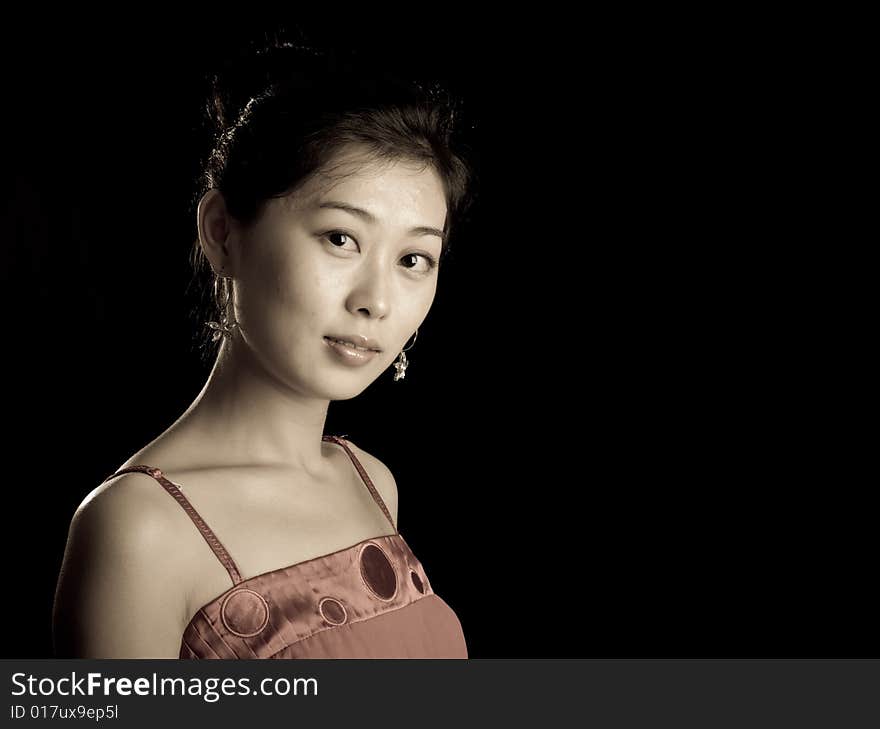 Cute asian lady isolated on black background