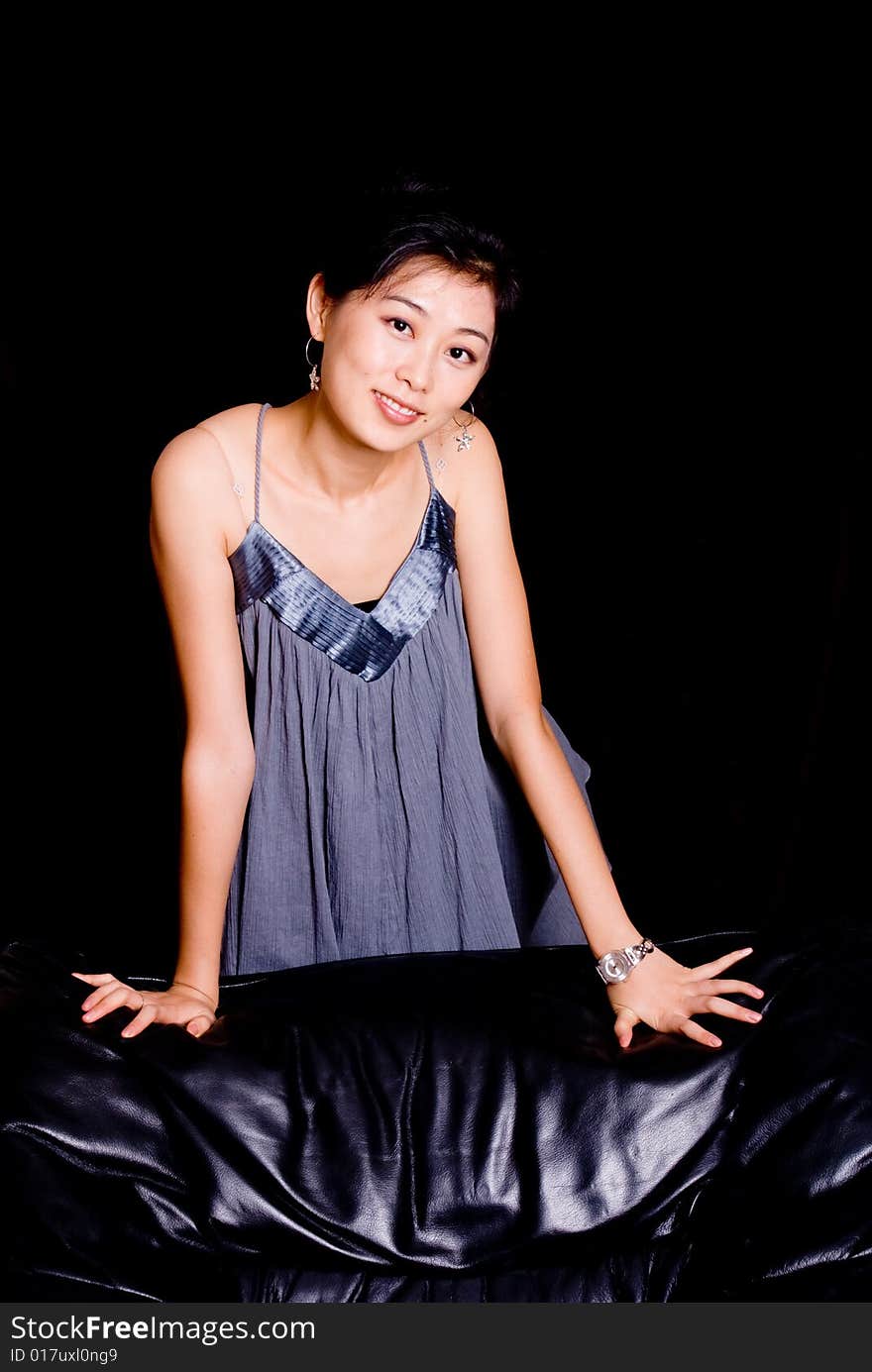 Attractive Asian female model in skirt with smile. Attractive Asian female model in skirt with smile