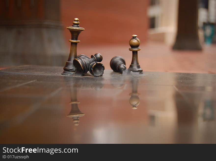 Brass chess figures taken in Portland Oregon's town square. Brass chess figures taken in Portland Oregon's town square