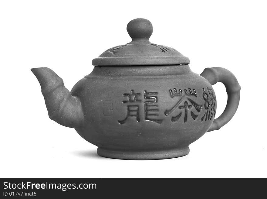 East black and white teapot on white background with a little shadow. East black and white teapot on white background with a little shadow