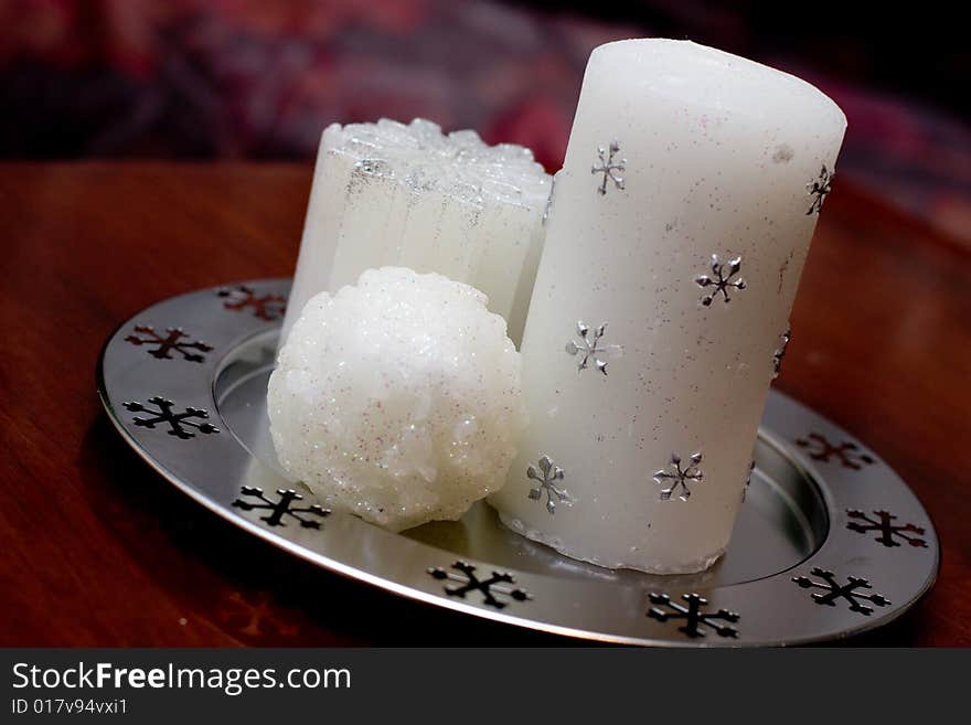 Group of pure white christmas candles on a tray. Group of pure white christmas candles on a tray