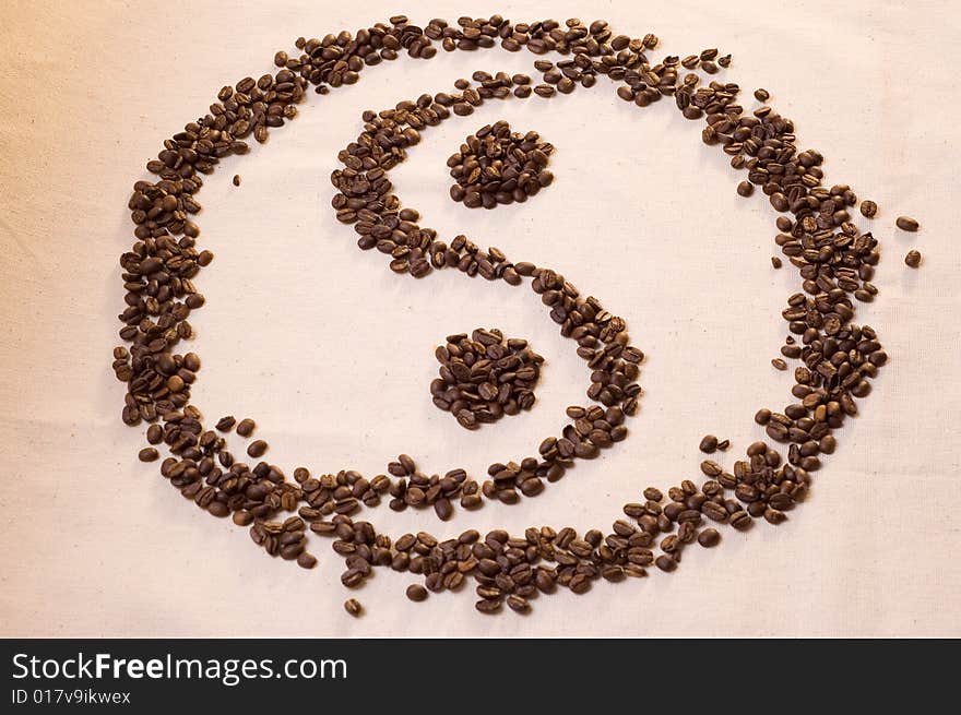 Yin yang symbol from coffee beans