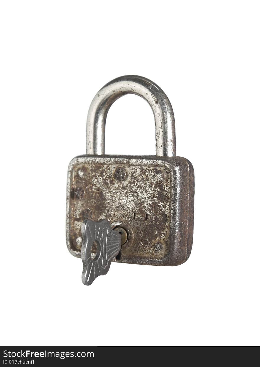 A closed lock with a key isolated on white background. A closed lock with a key isolated on white background.