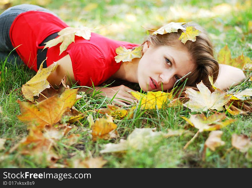 Young woman and leaves