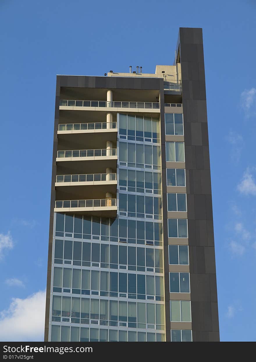 Modern west side loft building on blue sky background. Modern west side loft building on blue sky background.