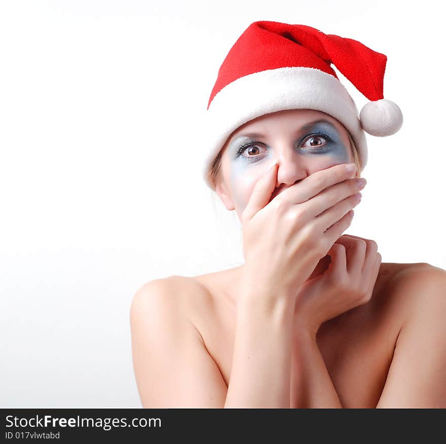 Young beautiful woman in a santa hat with winter make-up. Young beautiful woman in a santa hat with winter make-up