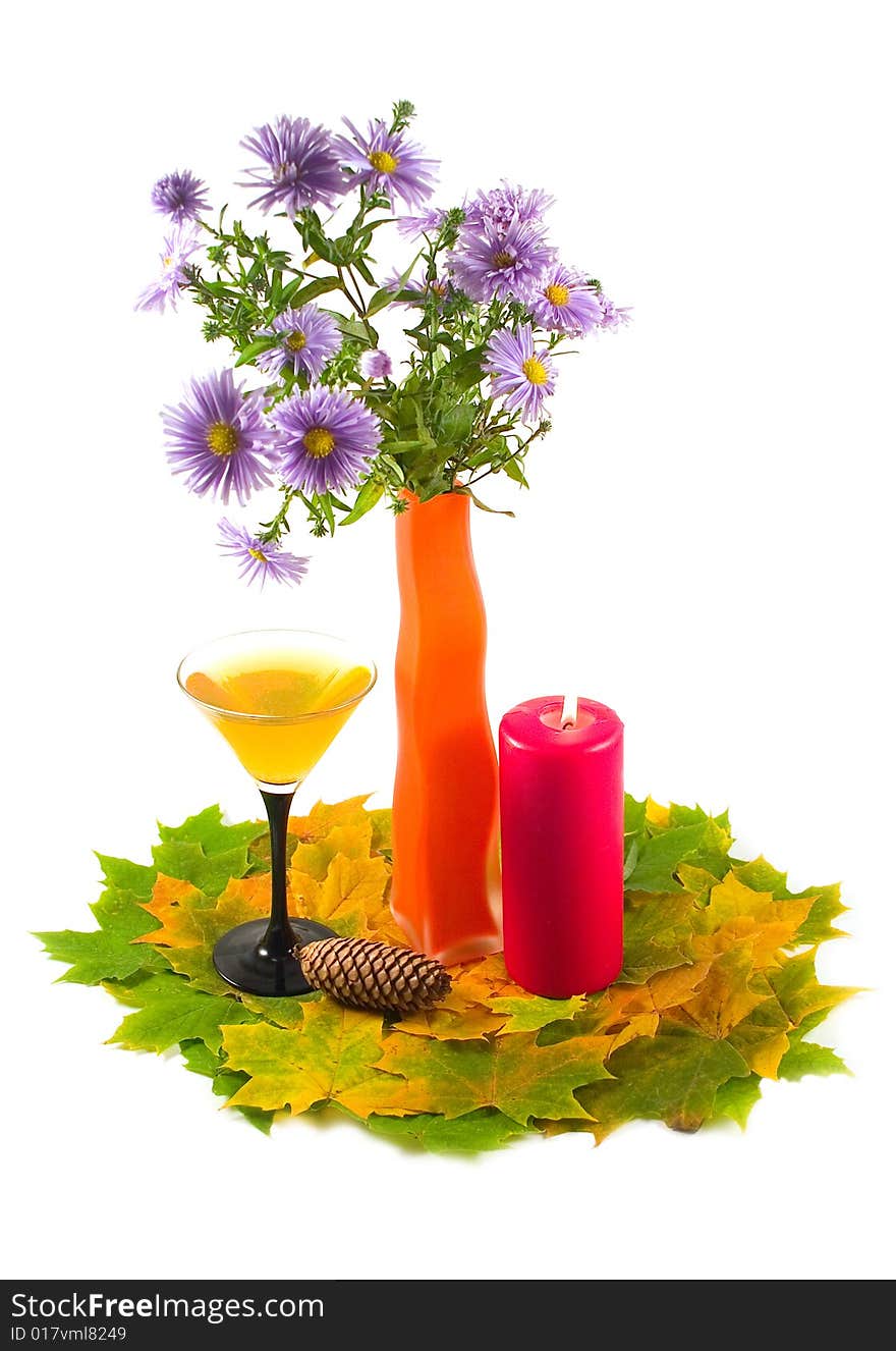 Bouquet of colors in orange decorative vase with autumn leaves on white background. Bouquet of colors in orange decorative vase with autumn leaves on white background