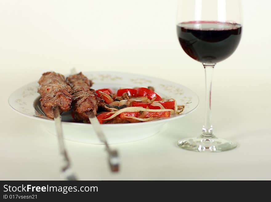 Image of grilled meat and wine