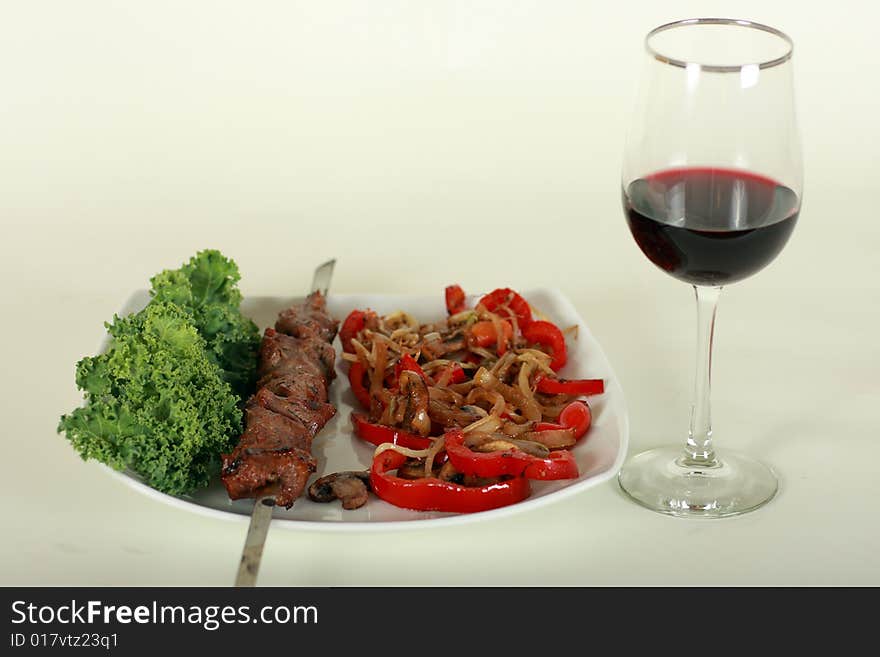 Image of grilled meat and wine