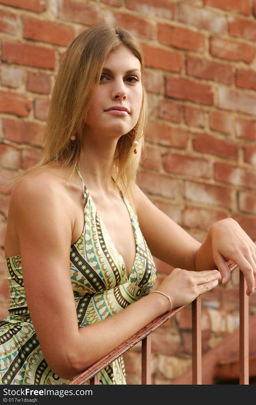 Beautiful young woman wearing a green dress