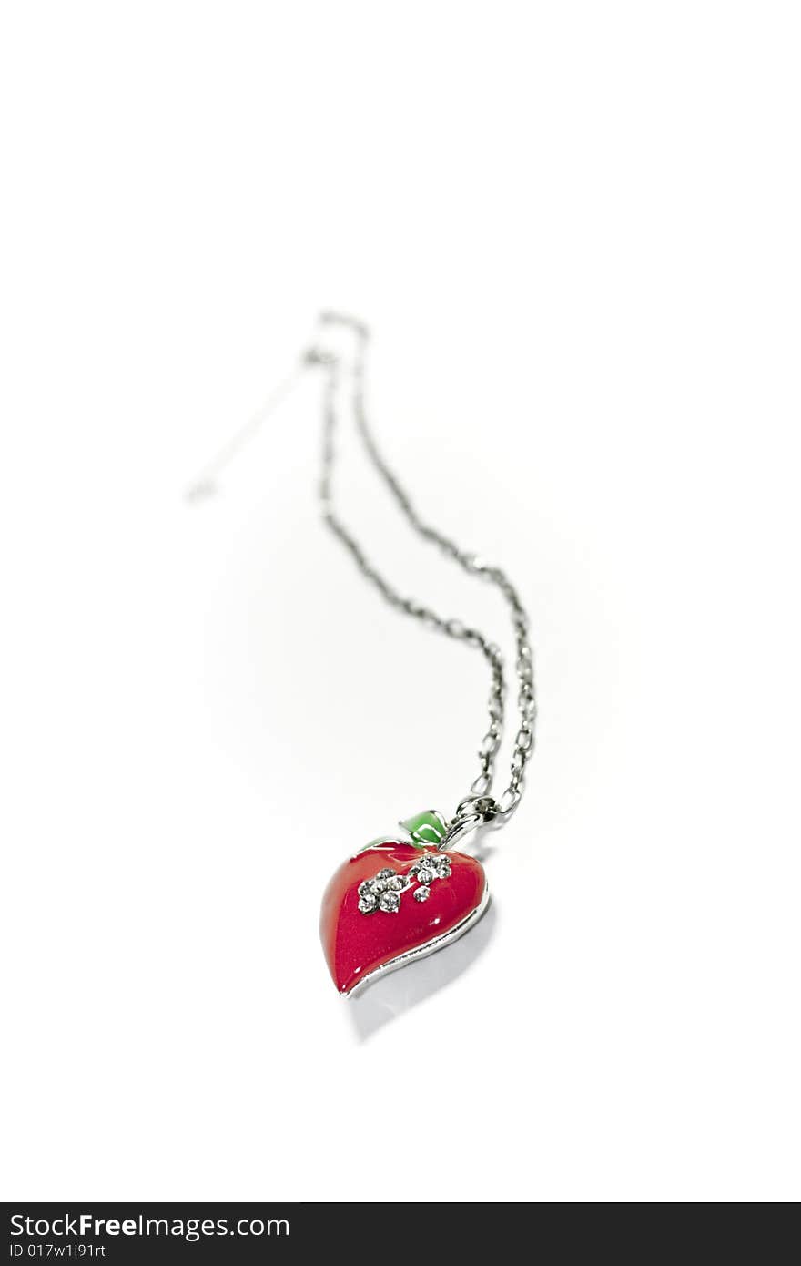 Red heart, pendant, lavaliere, silver, on white background. Red heart, pendant, lavaliere, silver, on white background