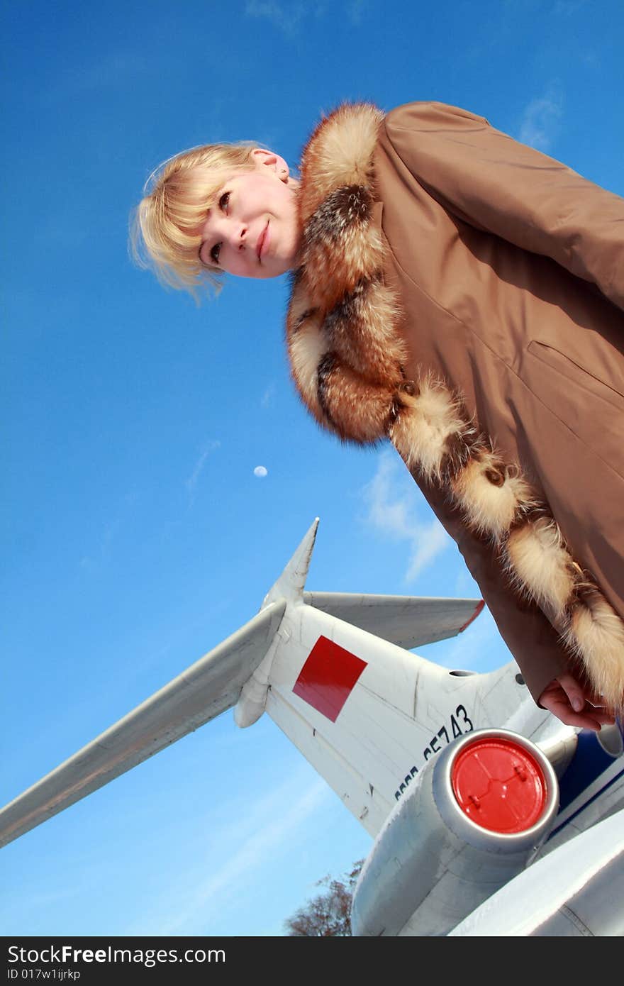 Beautiful flight attendant standing at the airplane. Beautiful flight attendant standing at the airplane