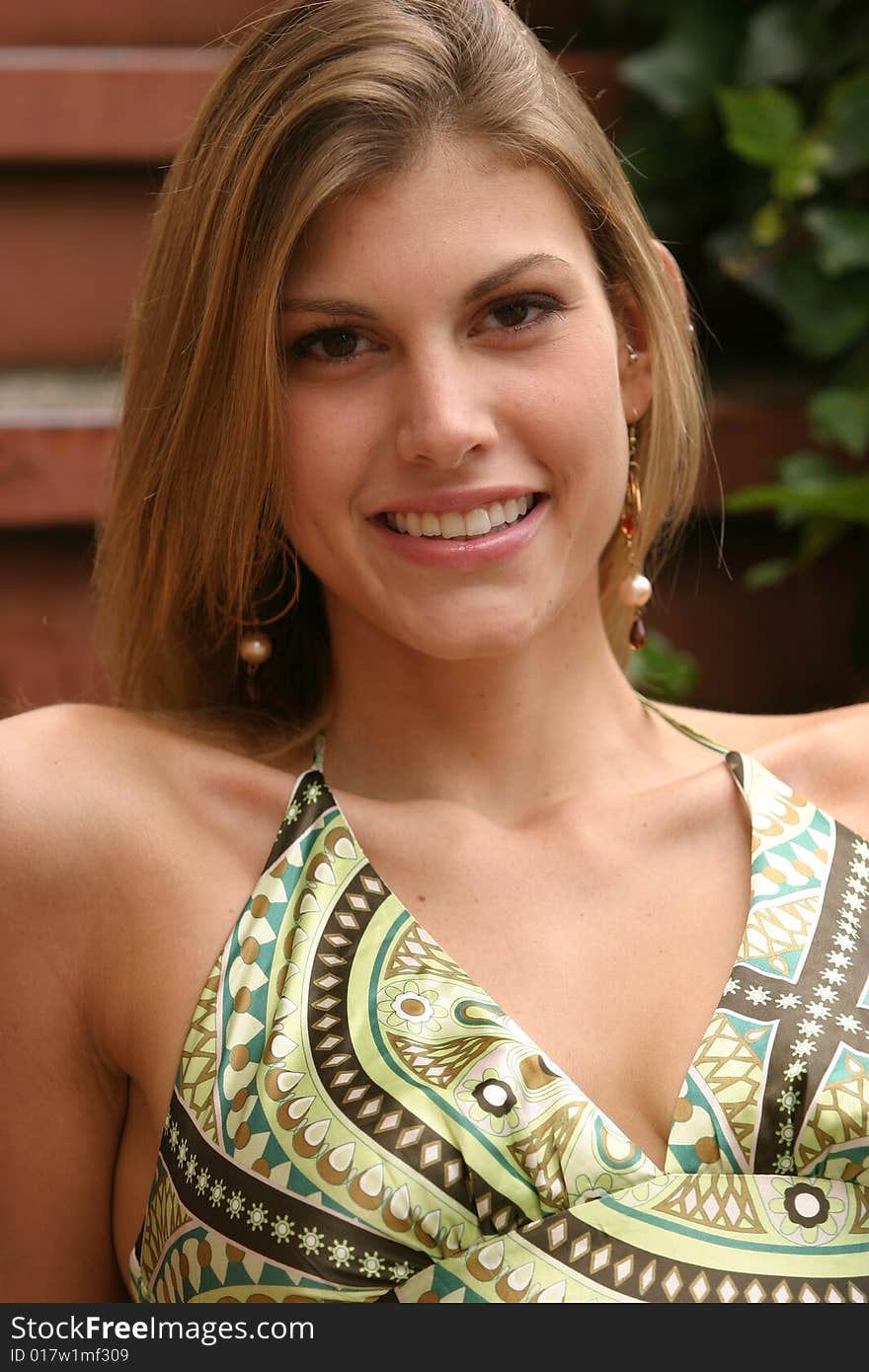 Beautiful young woman wearing a green dress