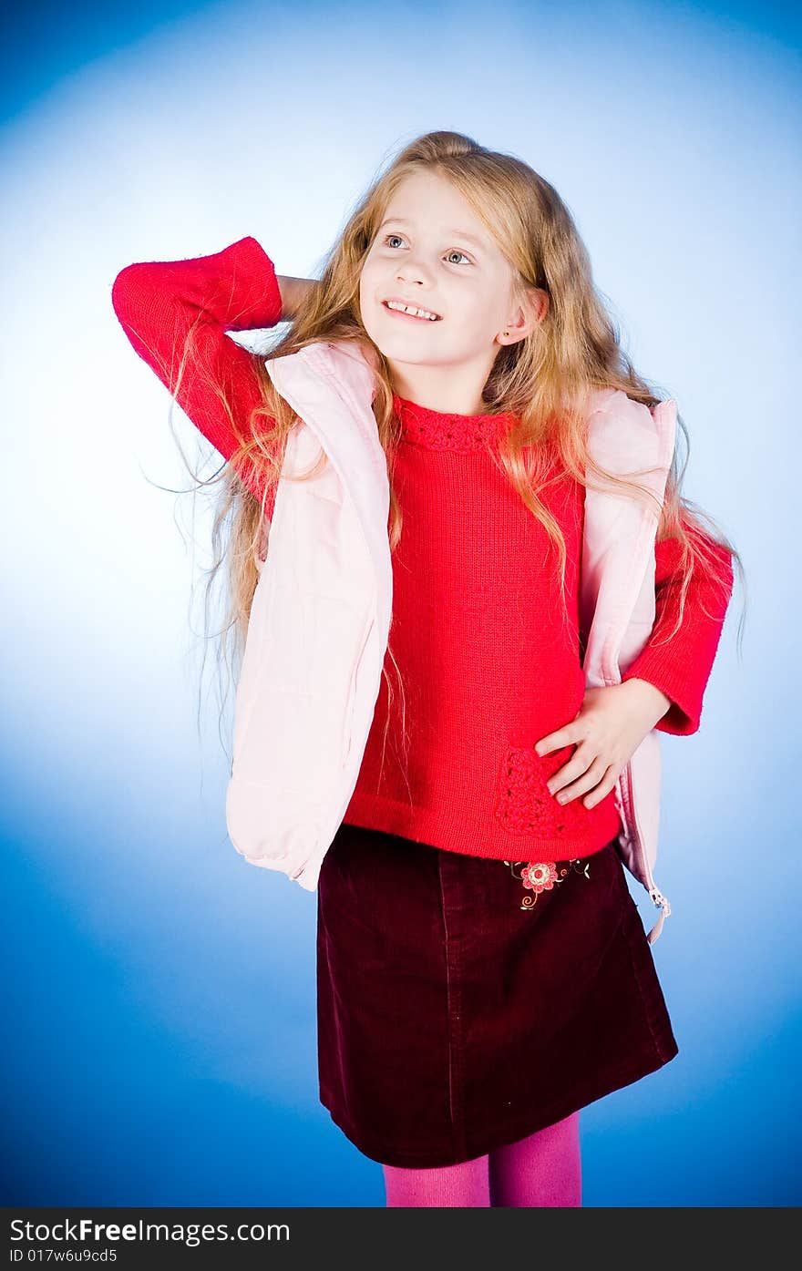 Funny girl in red sweater, studio shot