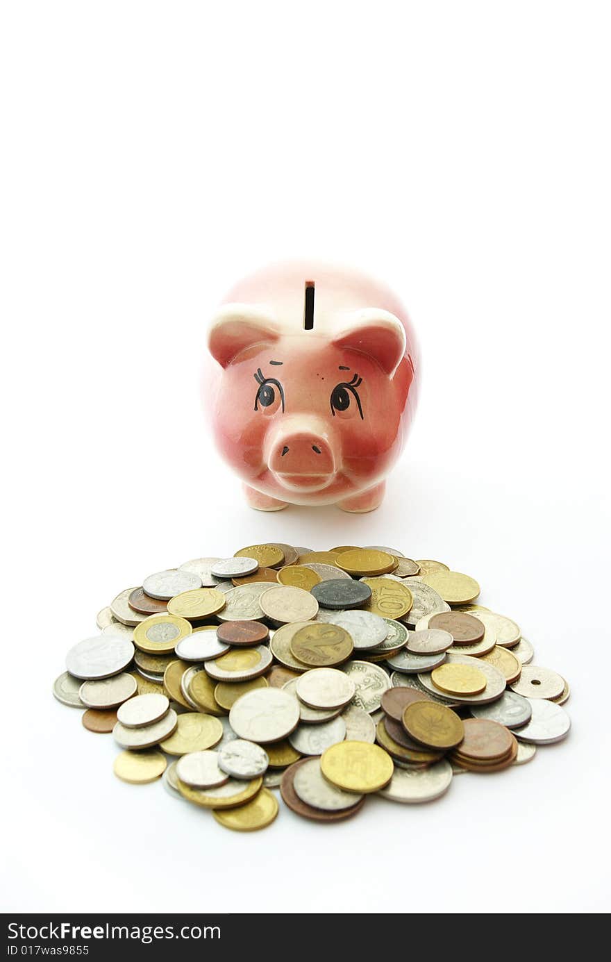 Pink piggy bank  isolated on white background with coins