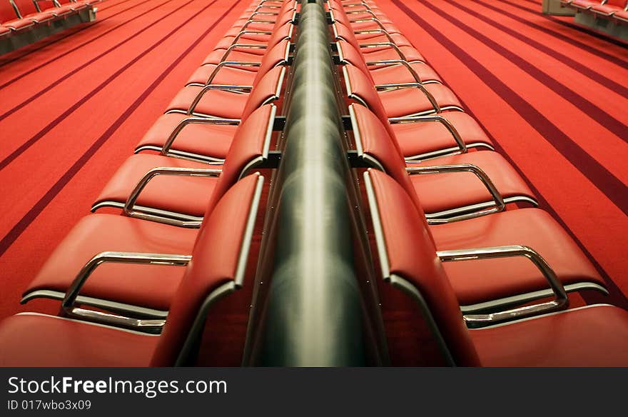 Photo of red chairs in airport