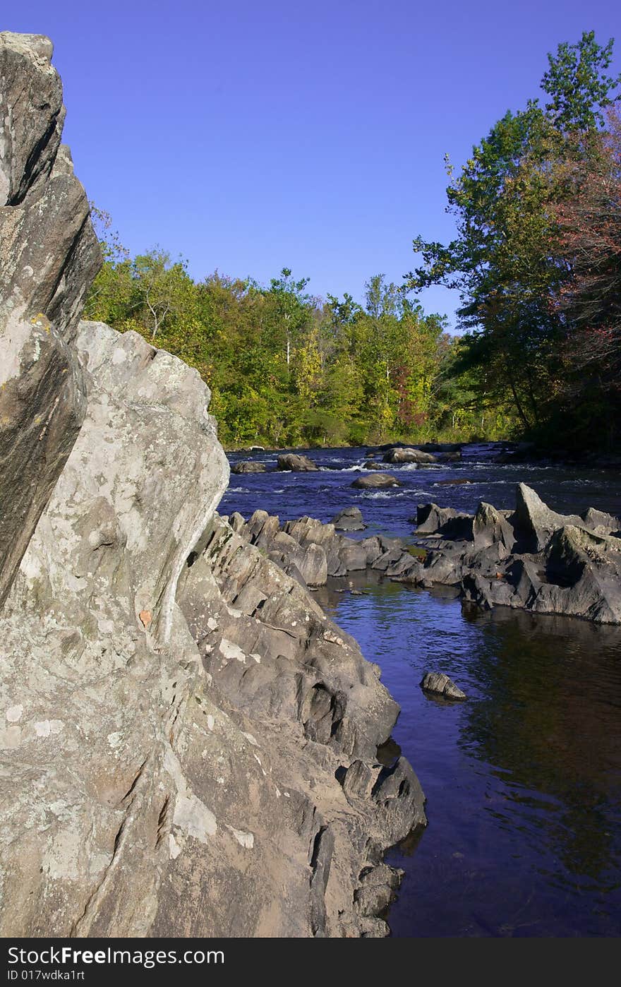 A view of river with rock wall. A view of river with rock wall