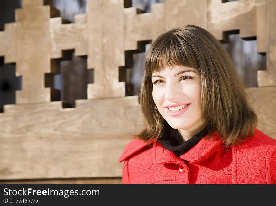 Pretty Girl On The Wooden Background