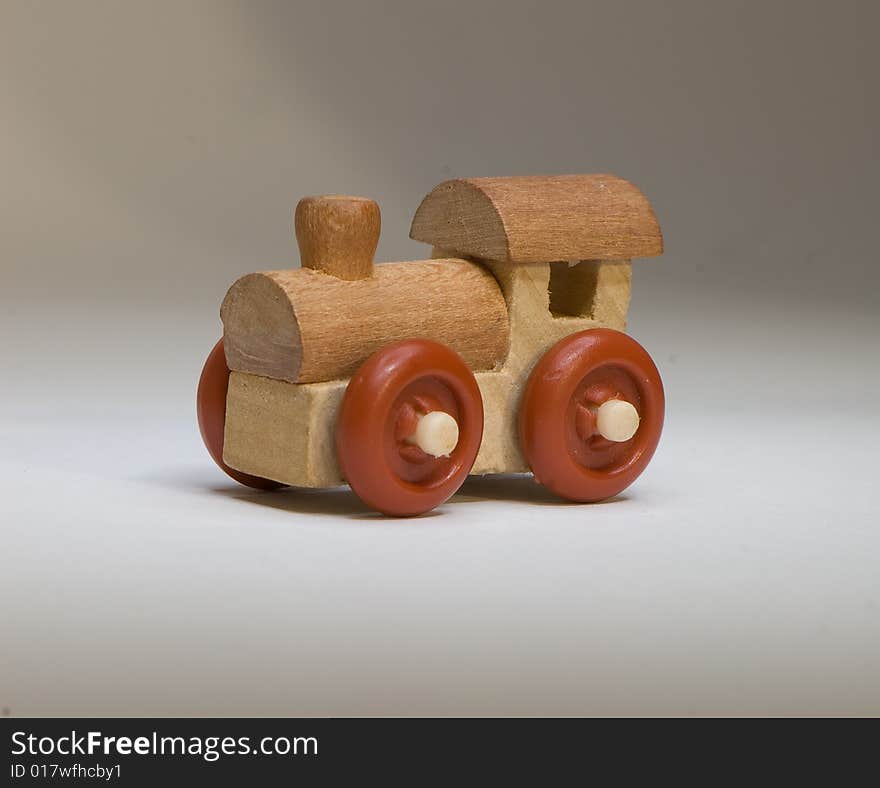 Wooden toy train on a light background