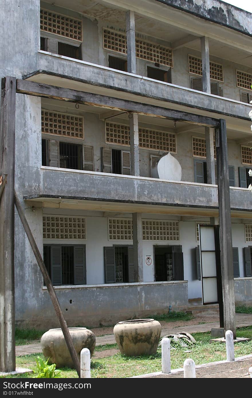 Infamous gallows and water jars in front of Khmer Rouge S21, Tuol Sleng prison building, Phnom Penh, Cambodia. Infamous gallows and water jars in front of Khmer Rouge S21, Tuol Sleng prison building, Phnom Penh, Cambodia